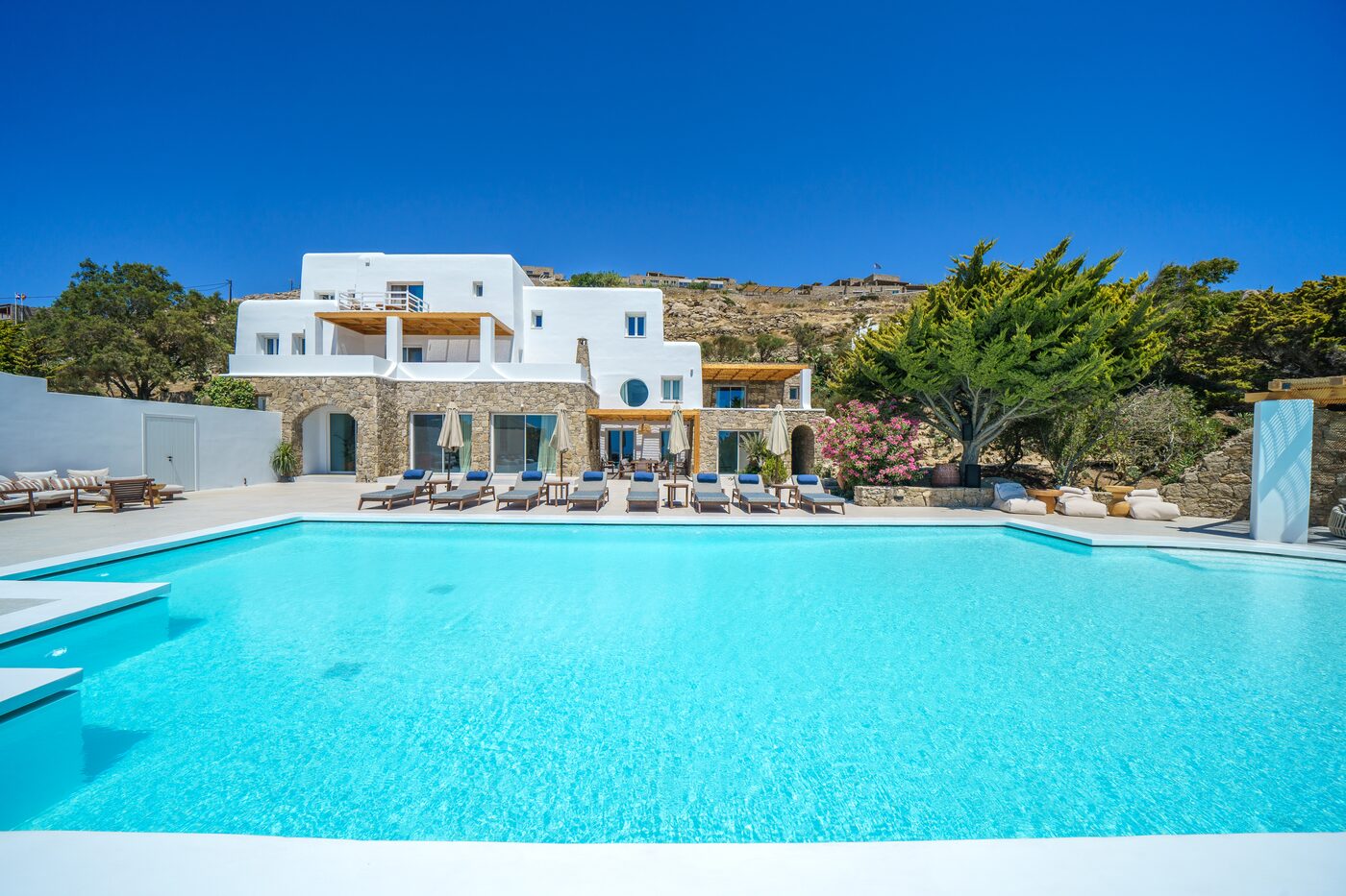 Large infinity pool below the Primadonna villas on the Mykonian hillside