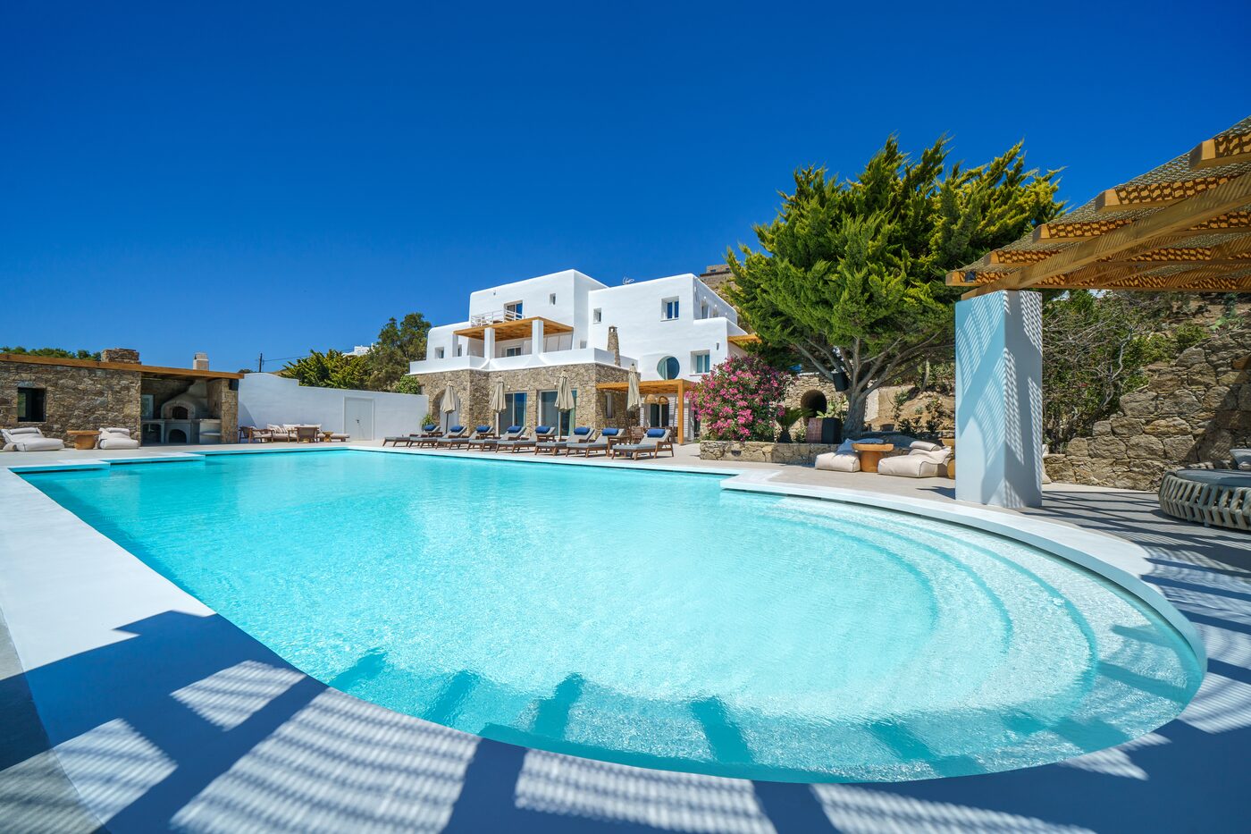 Wide infinity pool and sun terrace at Primadonna, Mykonos