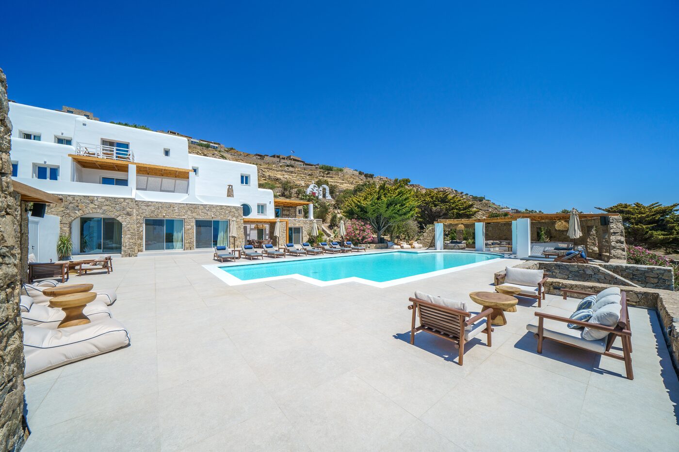 Pool terrace and loungers with island views over Mykonos