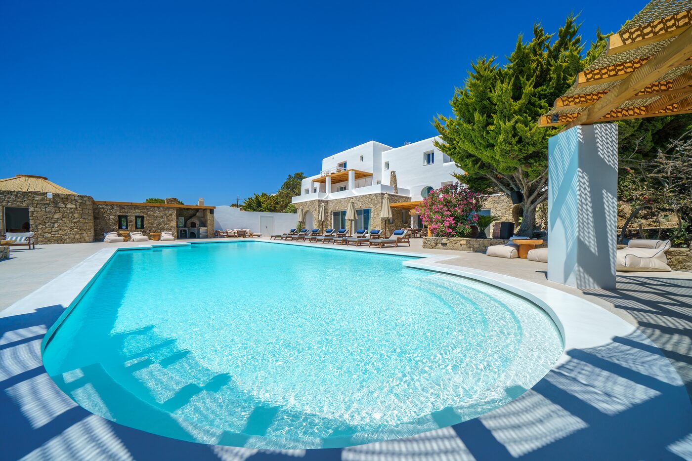 Infinity pool merging with the open Aegean horizon, Mykonos