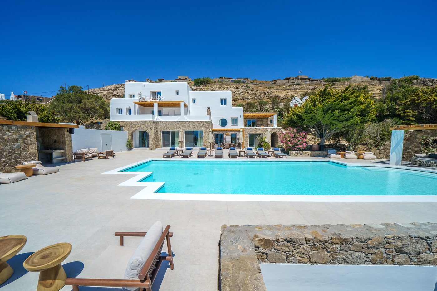 Villa facade, pool and sun loungers at Primadonna, Mykonos