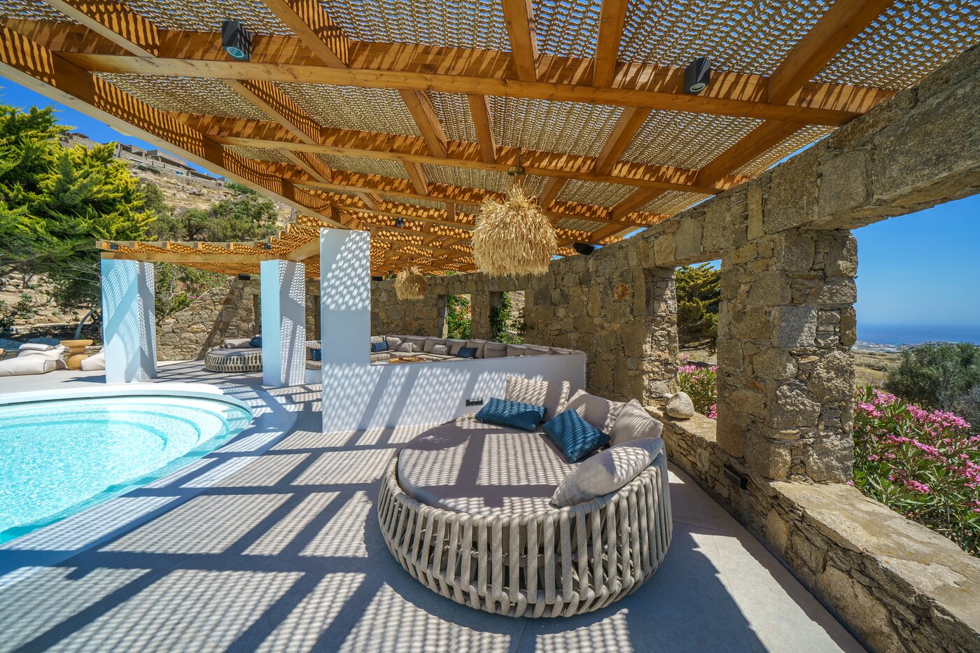 Shaded pergola lounge with daybeds at the Primadonna estate