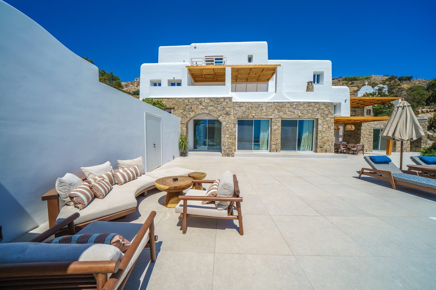 Outdoor sofa lounge on the villa terrace at Primadonna