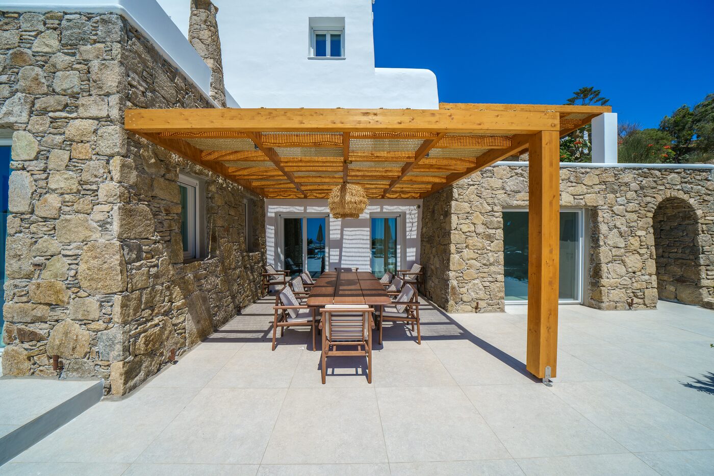 Timber pergola and stone terrace at the Primadonna estate
