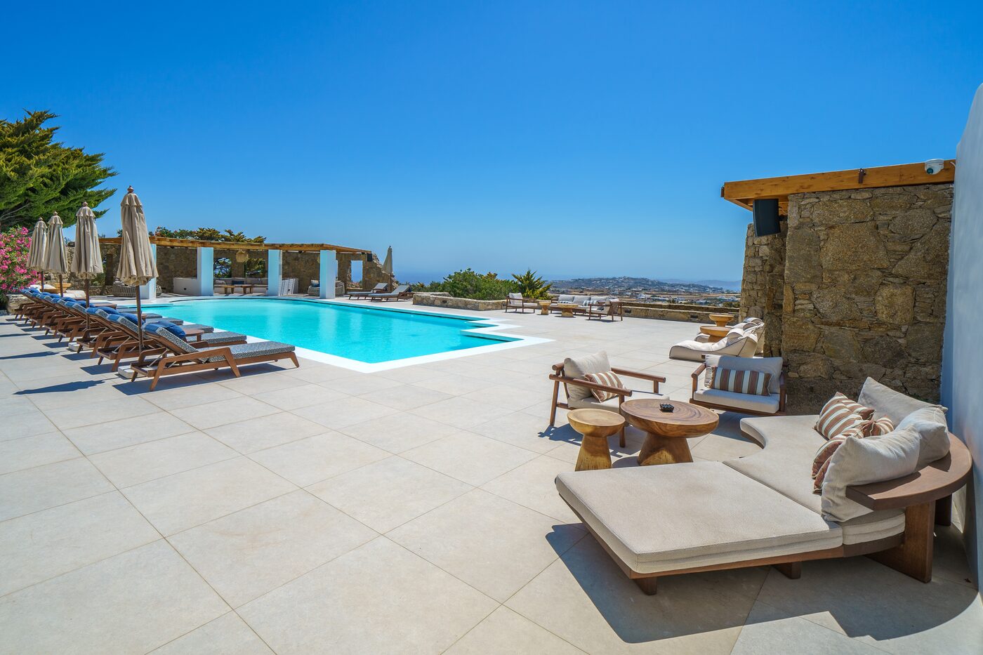 Daybeds on the sea-view terrace beside the pool in Mykonos