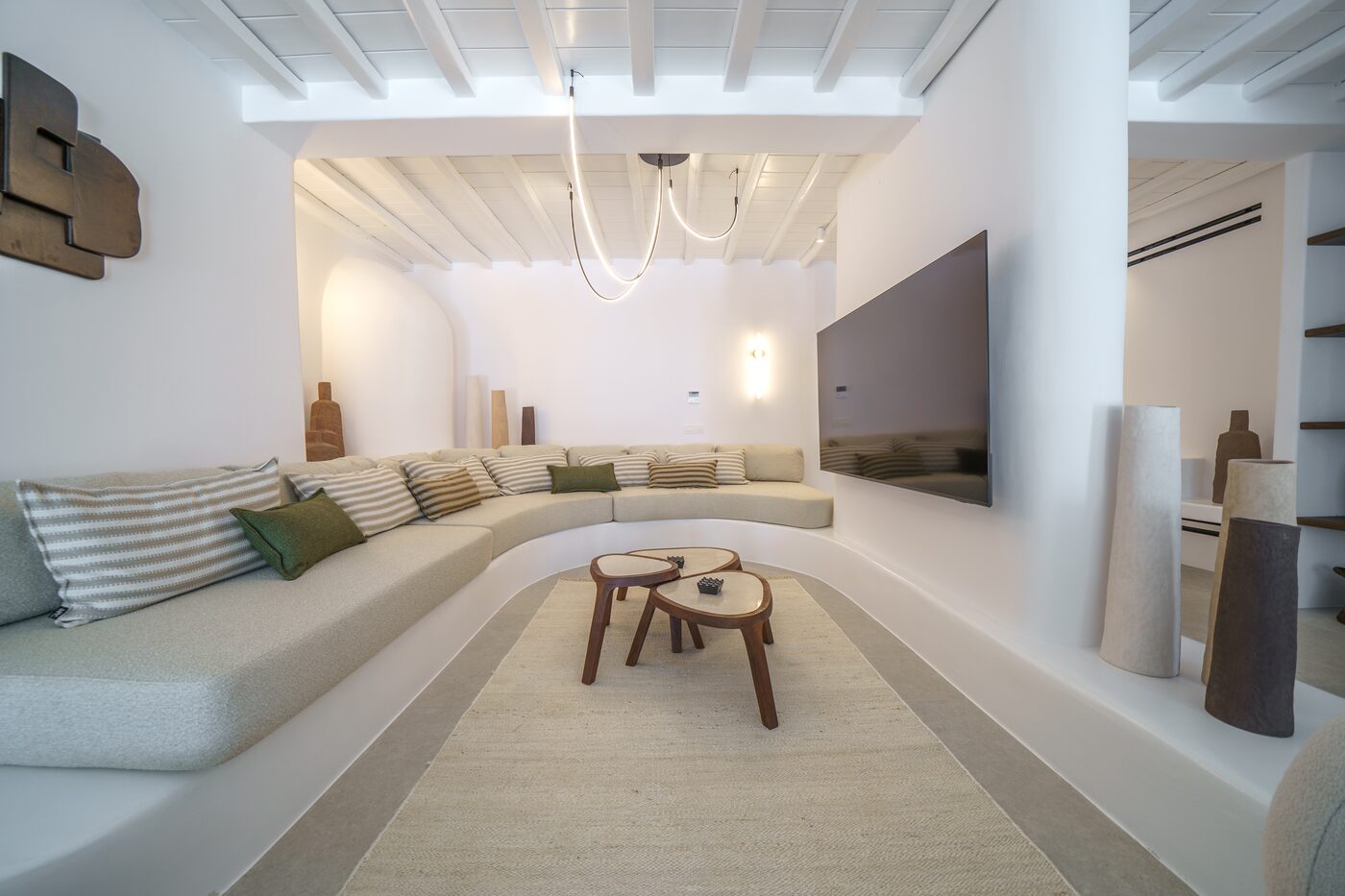 Villa Primadonna living lounge with curved sofas and sculptural coffee tables