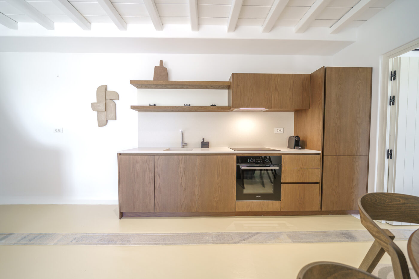 Villa Afrodite kitchen with oak cabinetry and an integrated oven
