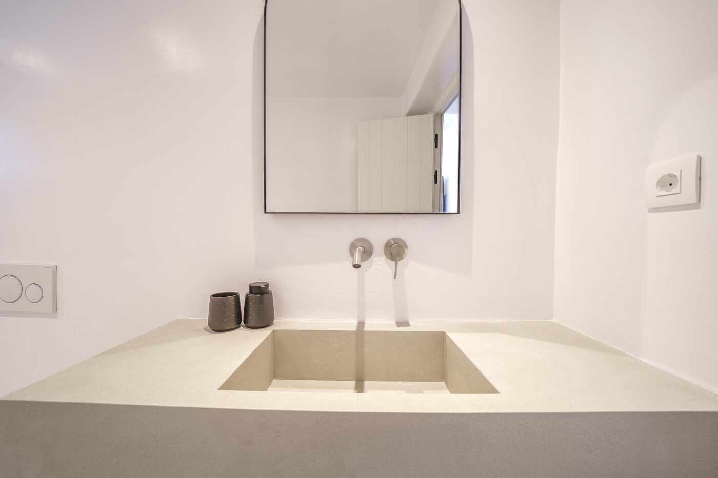 Villa Catherine ensuite bathroom with a sculptural stone washbasin