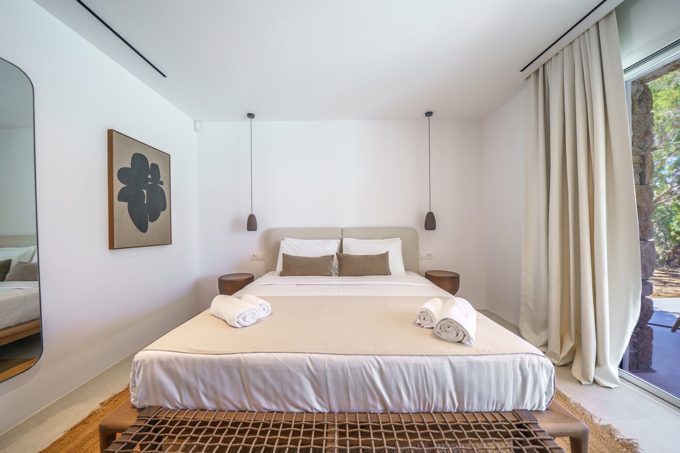 Villa Catherine bedroom with a double bed and framed artwork