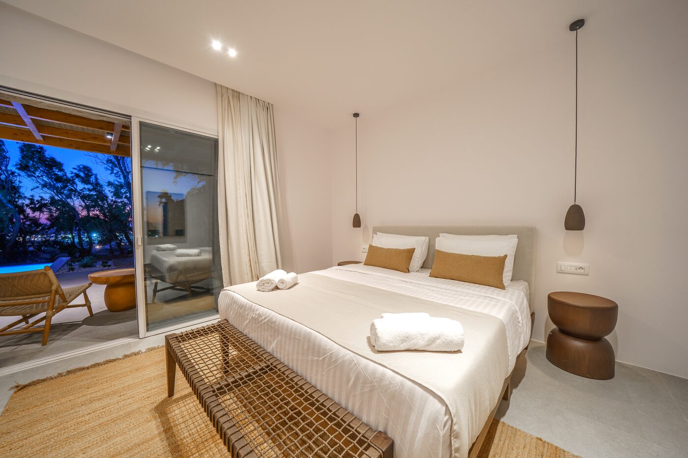 Villa Catherine bedroom with pool views at blue hour