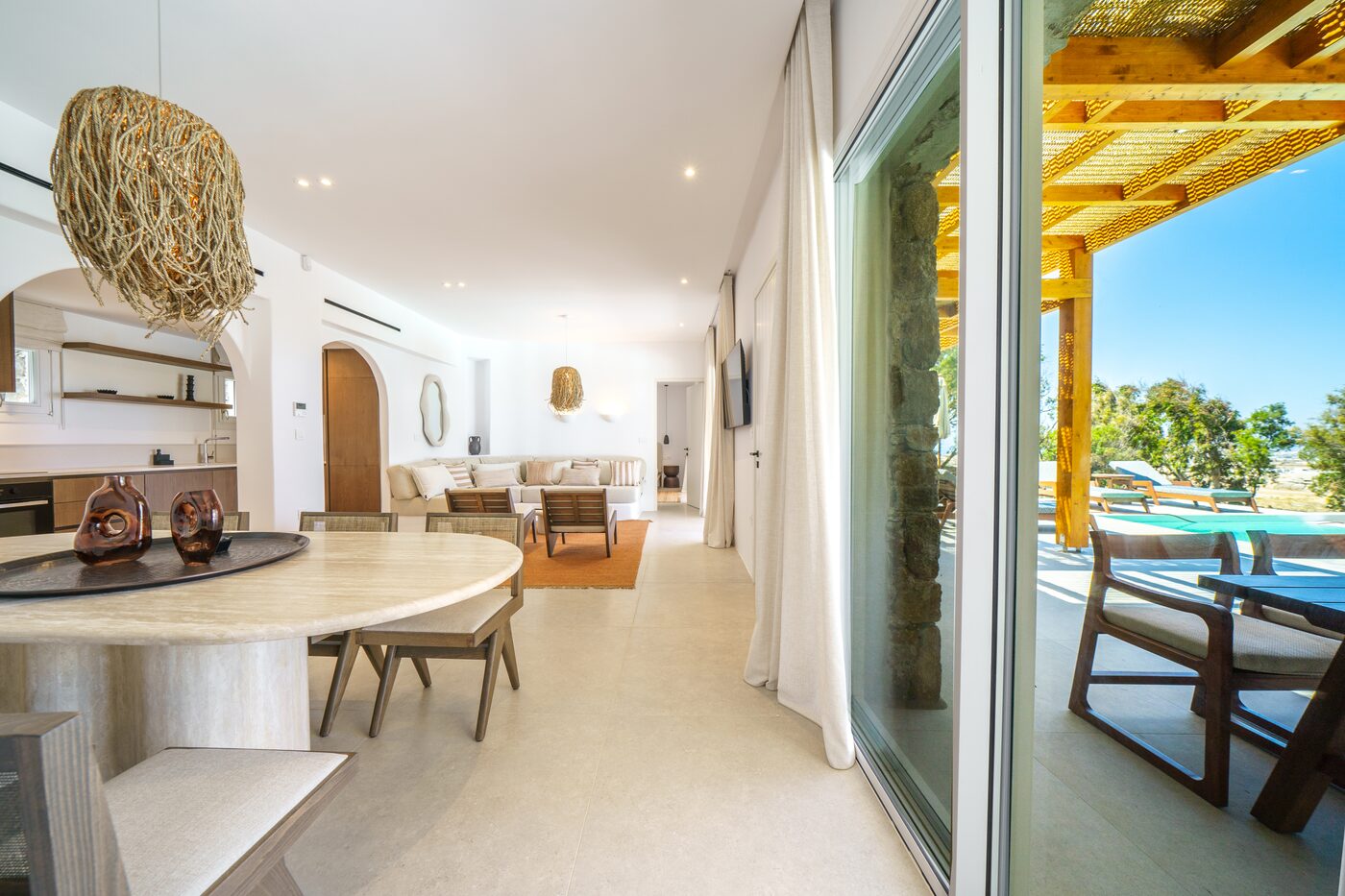 Villa Catherine open-plan living and dining area opening to the pool terrace