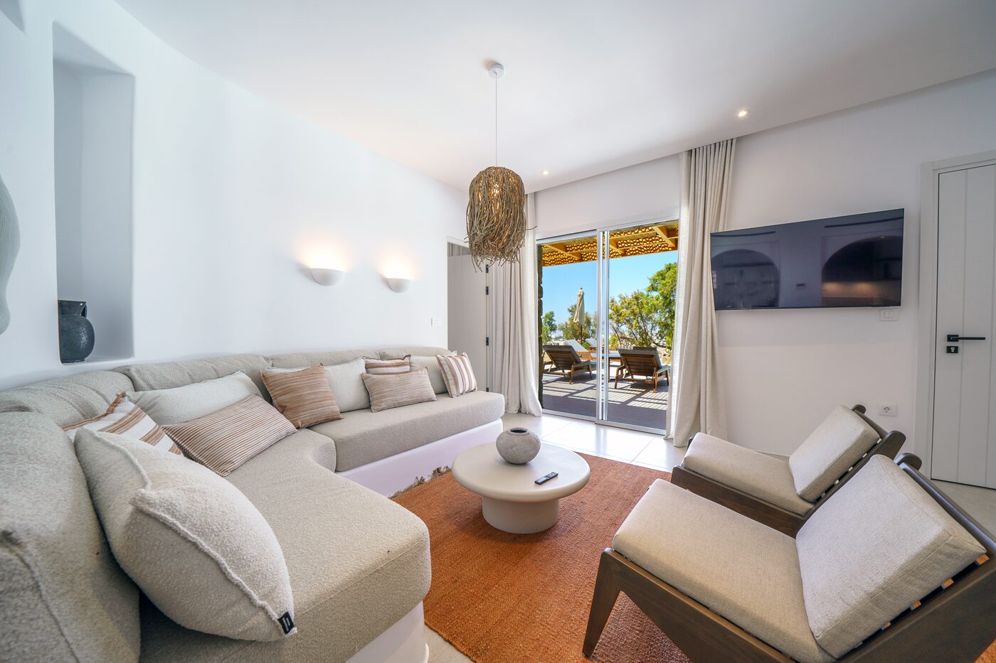 Villa Catherine living room with a sectional sofa and terrace doors