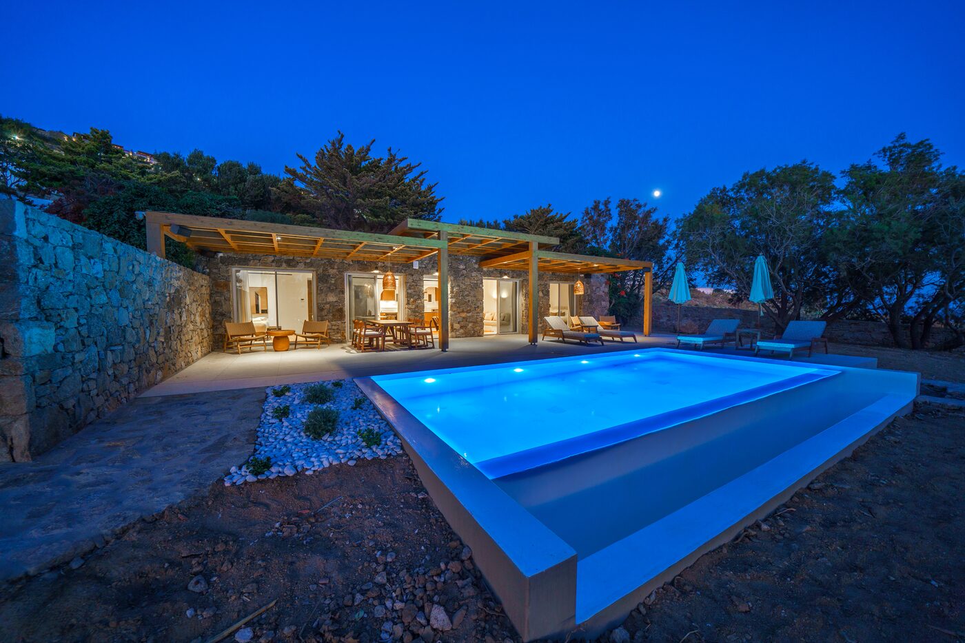 Villa Catherine pool and illuminated villa at blue hour