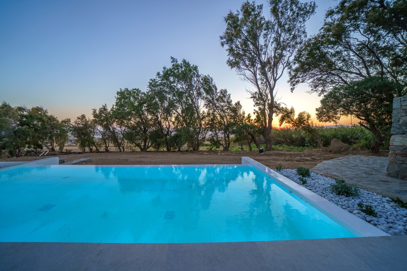 Villa Catherine horizon pool glowing at sunset