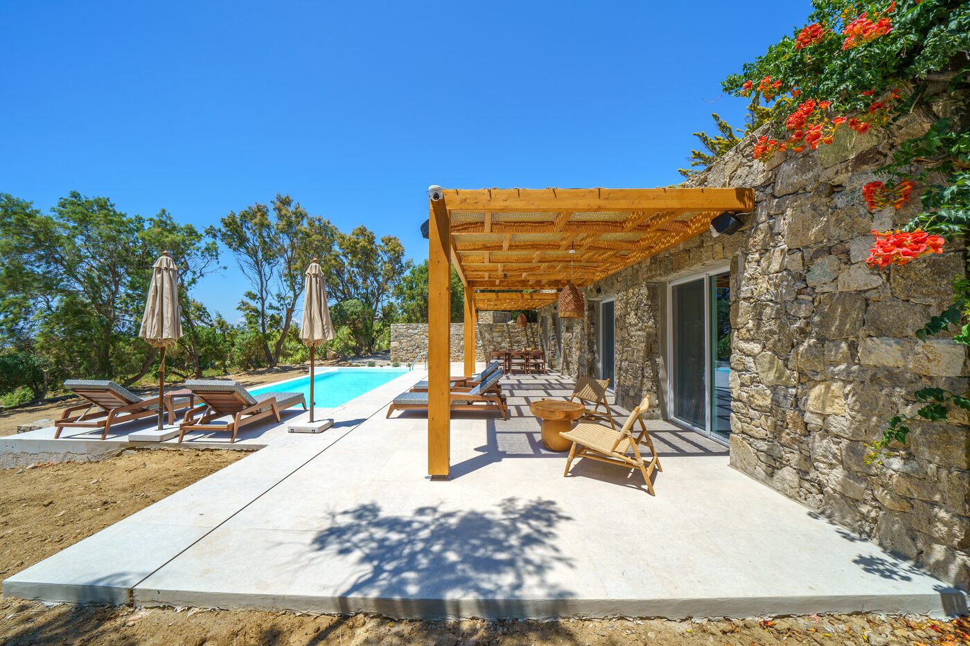 Villa Catherine pergola-shaded pool terrace framed by bougainvillea