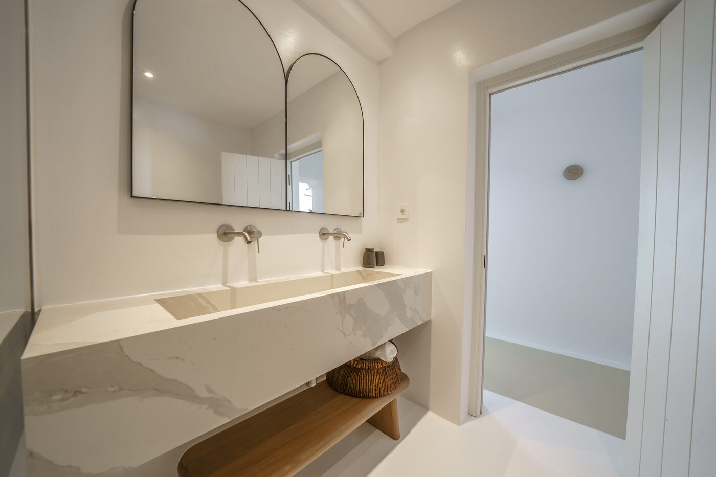 Villa Primadonna ensuite bathroom with a travertine double washbasin
