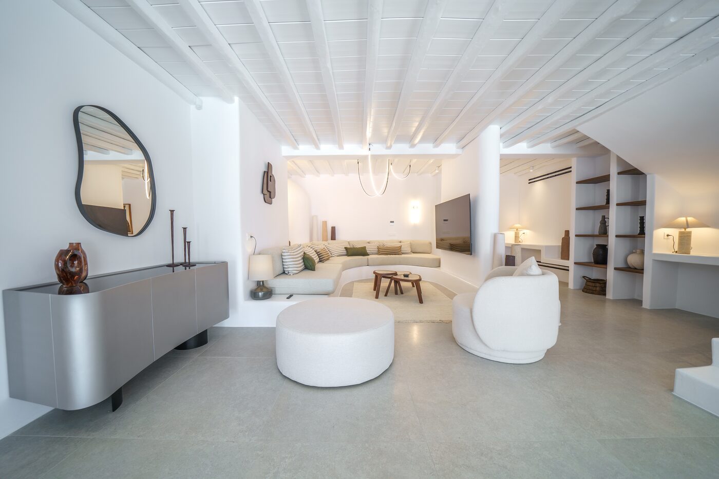 Villa Primadonna living lounge with curved sofas and sculptural tables