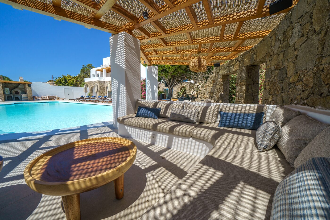 Villa Primadonna shaded pergola lounge with daybeds beside the pool