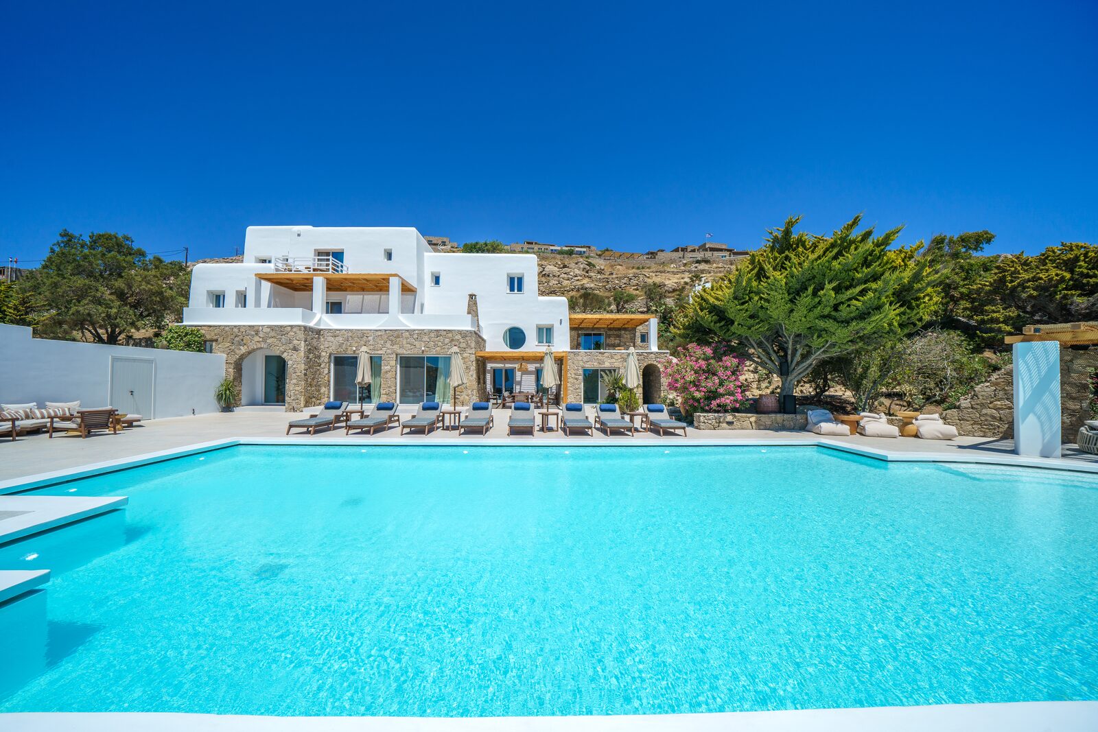 Primadonna estate and pool seen across the Mykonian hillside
